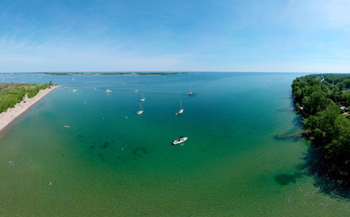 Toronto Central Islands and Ward's Island Park beach, Ontario, Canada, aerial view from top at sunny greenery and sandy coast with boats, people swimming at summer. Popular tourist location.