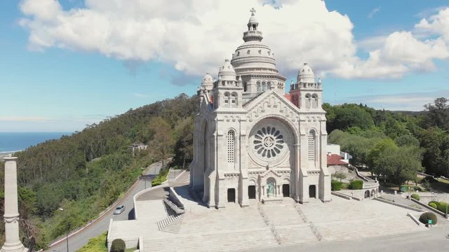 AERIAL DRONE FOOTAGE - The Monument Temple of Santa Luzia, dedicated to the Sacred Heart of Jesus in Viana do Castelo, Portugal. Its imposing rose windows are the largest in the Iberian Peninsula.