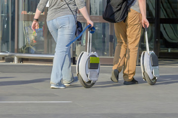 people go with an electric monowheel to the shopping center © justoomm
