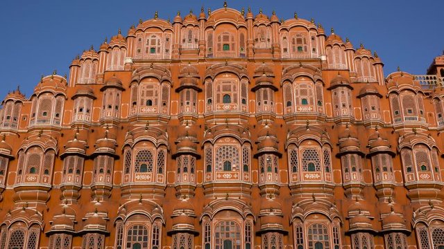 Hawa Mahal, pink palace of winds in old city Jaipur, Rajasthan, India.  Tilt Down Shot of Hawa Mahal. Red and pink sandstone construction.