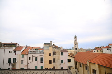 Colorful old town and beach in Menton on french Riviera in a beautiful summer day, France