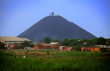 A famous 500 foot slag mountain made from copper mining residue rises above the countryside in...