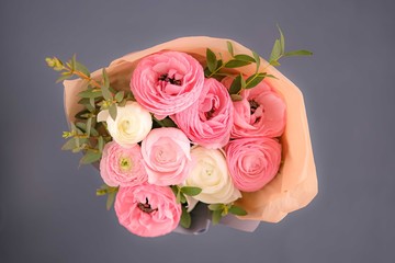 pale pink ranunculus on blue background