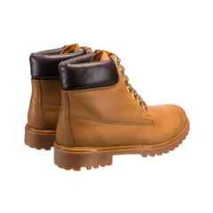 touring light brown boots with lace-up tread isolated on a white background