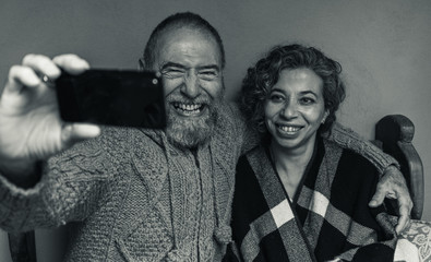 older couple taking a selfie