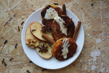 Cottage cheese pancakes cottage cheese with apple, nuts, and cinnamon. Ukrainian traditional food. Ukrainian national kitchen. 