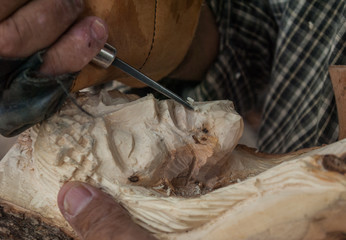 Native Indigenous craftsman working on a Wood carved sculpture of Jesus face Tepatitlan de Morelos,...