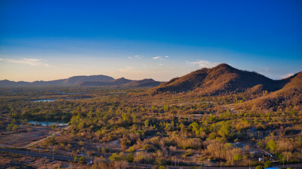 Fototapeta premium This unique photo shows the hilly landscape, from hua to thailand, taken with a drone by the evening sun during a wonderful sunset!