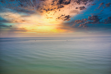 This unique photo shows the calm sea of the Gulf of Thailand during a beautiful sunset with fishing boats on the sea. Picture was taken with a drone.