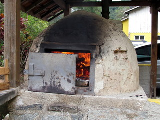 Preparing the roast in the wood oven