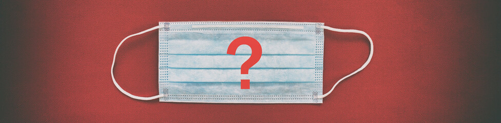 Corona virus face mask top view with red question mark background panoramic banner. Why use masks,...