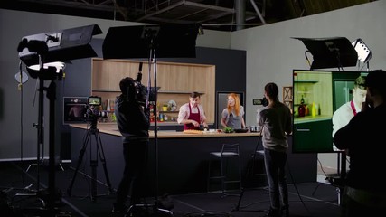 WIDE Behind the scenes of studio set, shooting TV television cooking show featuring celebrity chef, professional TV production. Shot on ARRI Alexa Mini
