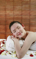 Obraz na płótnie Canvas Woman lying forward, resting on head pillow