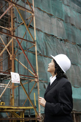 Naklejka na ściany i meble Businesswoman at the construction site