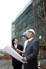 Business people having discussion at the construction site