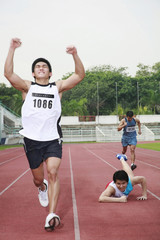 Man upon reaching finishing line
