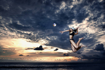 Woman reaching out to hit a ball