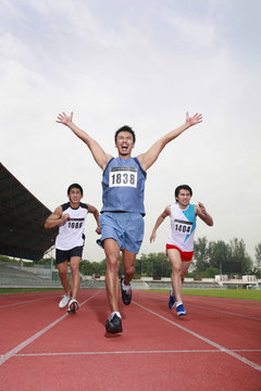 Men racing to finish line