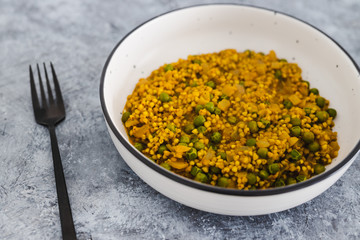 plant-based food,  vegan onion turmeric buckwheat with green peas