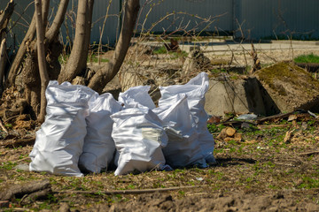 white garbage bags on the ruins of a building