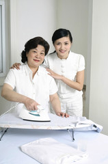 Fototapeta premium Two women ironing