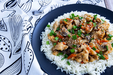 Stewed chicken with mushrooms, vegetables with herbs and rice