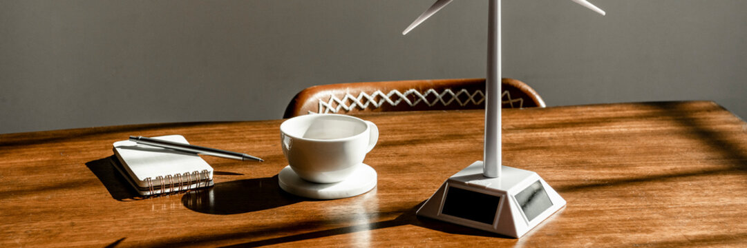 Solar wind turbine model on a wooden table