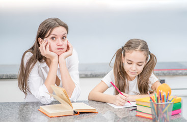 Tired woman worries about her kid's poor schooling