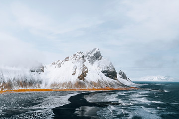 Beautiful black sand beach in winter at Vestrahorn in Iceland