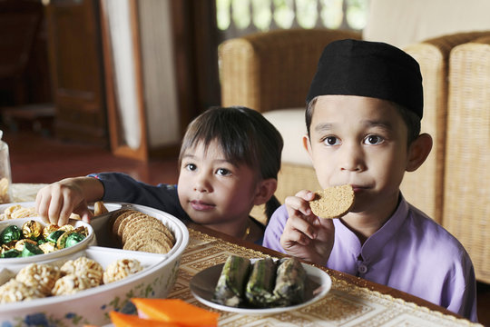 Boy Eating Cookies, Girl Taking Chocolates