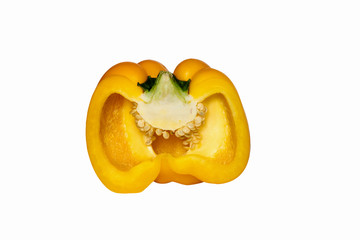 Close-up half-cut fresh yellow bell pepper isolated on white background with inner texture and seeds.