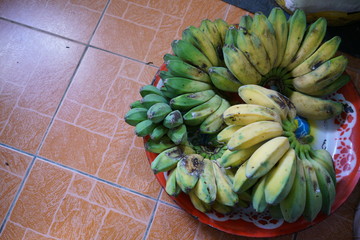 bunch of bananas. banana fruit on the tile background. 