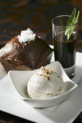 Steamed palm sugar sponge cake served with a shot of caramelized palm sugar and a scoop of coconut ice-cream