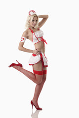 Woman in nurse outfit posing for the camera