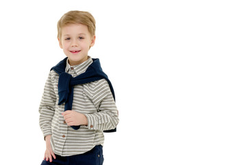 Handsome little boy in full growth on a white background. The concept of advertising, happy childhood.