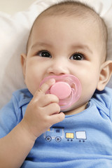 Baby sucking on pacifier