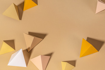 3D beige pyramid paper craft background design