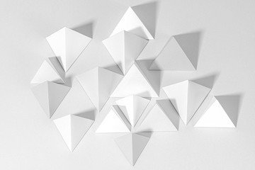 3D gray pyramid paper craft on a gray background