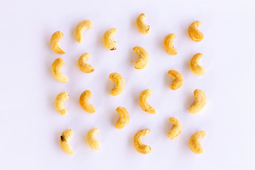 Roasted Cashew nuts isolated on white background with clipping path and full depth of field. Set or collection. Fly on Cashew nut