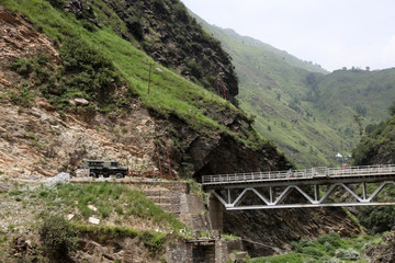 Fototapeta na wymiar Old bridge in the mountains, himalaya