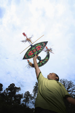 Boy flying moon-kite