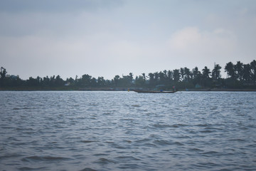 lake in the forest and boat in the cloudy weather for wallpaper, moody wallpaper