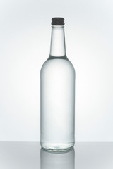 Mineral water in a clear glass bottle mockup