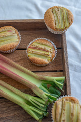 home made almond rhubarb muffins on a table