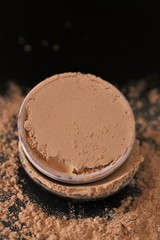 Amla  powder ayurvedic alternative medicine. Indian herbs for beauty.Amla powder in ceramic cups  on a black background. Natural herbal remedy for beautiful hair.Phyllanthus emblica