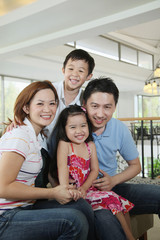 Boy and girl with their parents in the hotel lobby