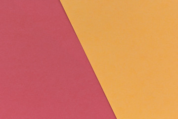 Color paper background. Two tone red and orange tone paper sheets overlap