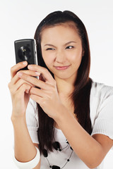 Woman taking picture with mobile phone
