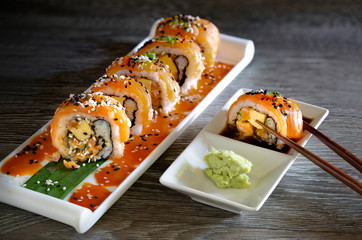 Salmon Sushi japanese food in white dish on gray wooden table dim light