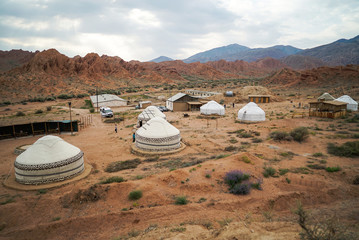Kyrgyz traditional yurts for tourism with canyon landscape in Kaji-Say, South of Issyk Kul Lake, Kyrgyzstan